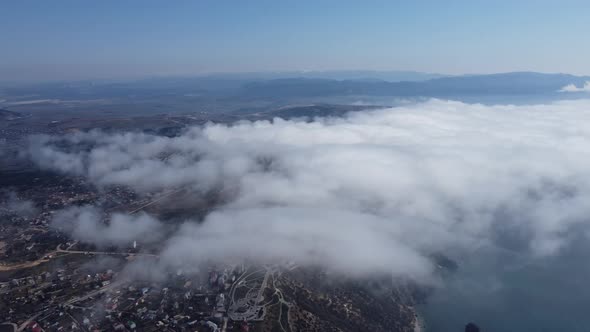 High Above the Thick Fog Like Beautiful Ocean of Clouds at Sunrise