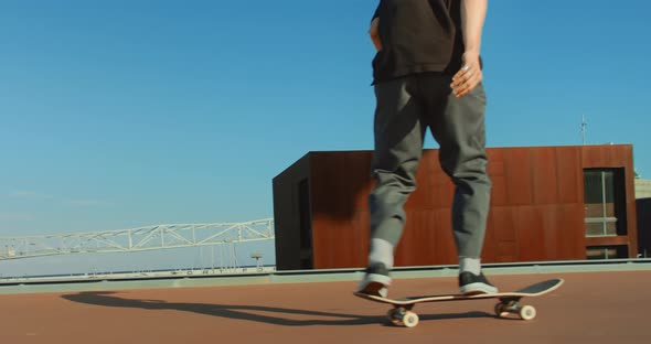 Modern Millennial Man Teenager on Skateboard