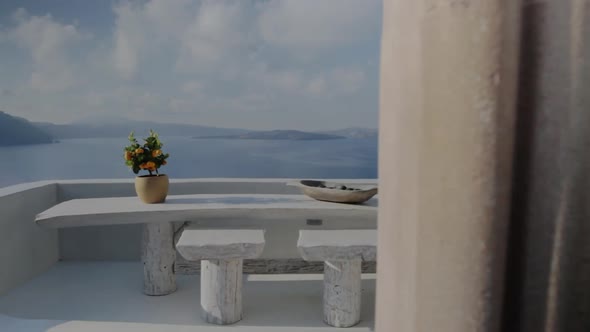 A terrace of a holiday villa overlooking the breathtaking seascape of Santorini.