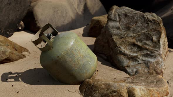 Old Cooking Gas Cylinder on Sand Beach