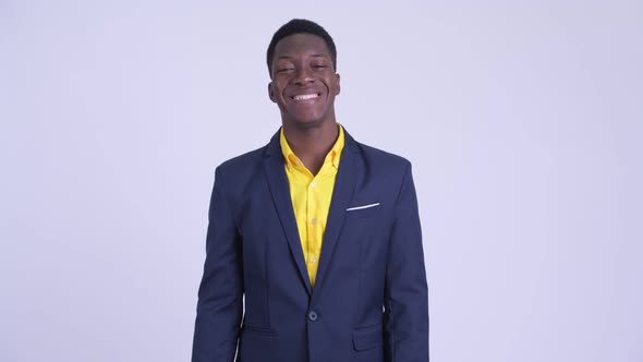 Young Happy African Businessman in Suit Smiling