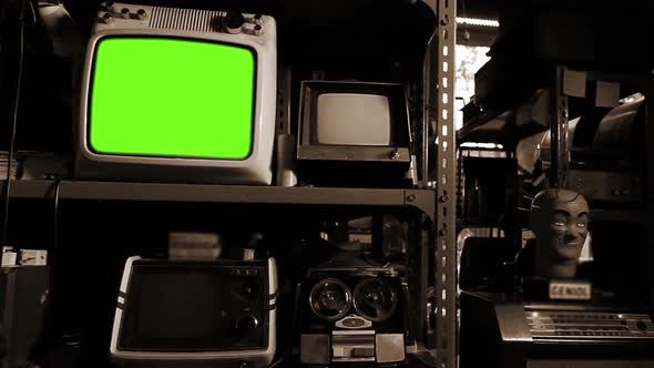 Retro Television Set turning on Green Screen in Antique Shop Interior. Sepia Tone.