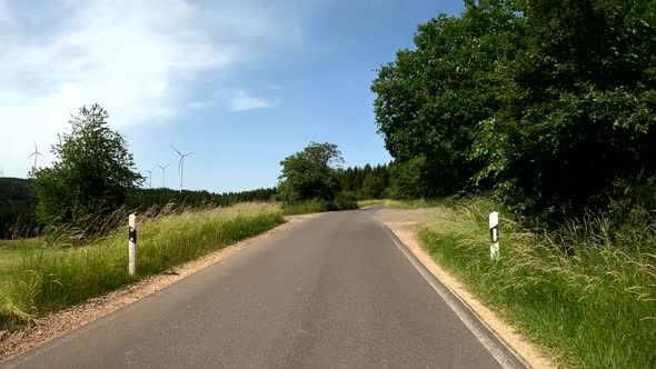 POV Driving on motorcycle on a scenic road in Eifel National Park in Germany