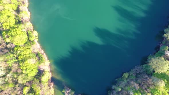 Flight over Oberwald lake near Frankfurt in Germany with top perspective