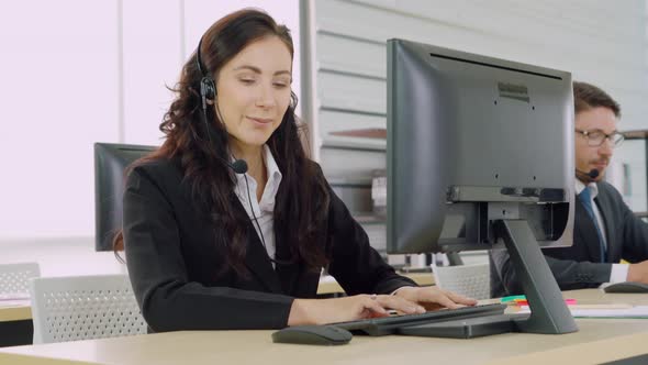 Business People Wearing Headset Working in Office