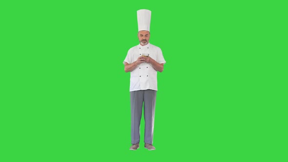 Restaurant Business Excited Chef Man Holding Money on a Green Screen Chroma Key