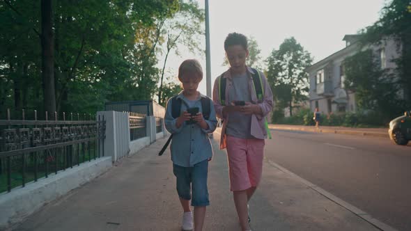 The Schoolboys Returning From School in a Sunset Time