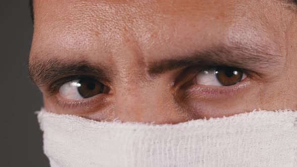 Portrait of Young Man in Protective Gauze Mask, Protection Coronavirus COVID-19