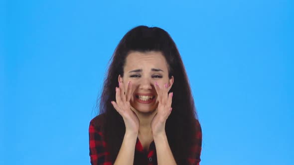 Pretty Lady Is Shouting with Her Hands Near Her Mouth. Slow Motion