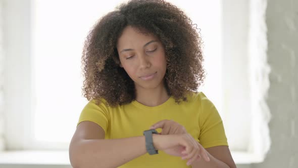 African Woman using Smart Watch