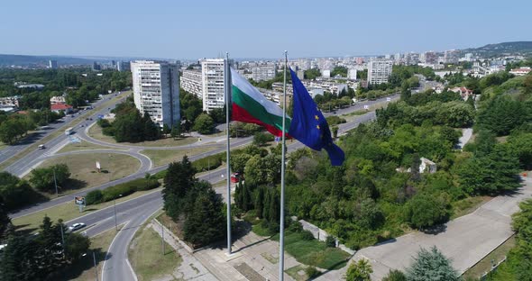 Bulgarian and European Union flags waving on the wind.  4K aerial dron video of Varna, Bulgaria.