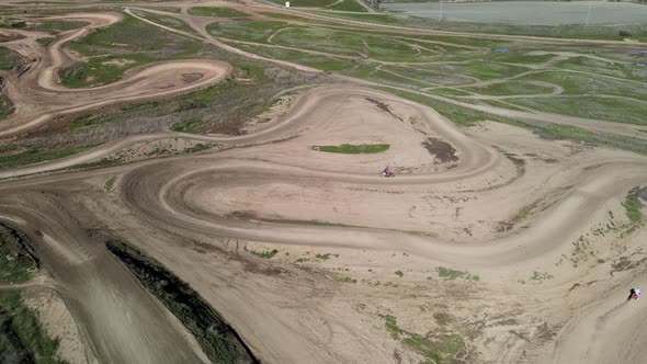 Two dirt bikes cornering on Prairie City Off-Highway motor vehicle recreation at the foothills of th