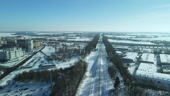 City quarters. Multi-story houses. Winter cityscape. Flight with a camera turn. Aerial photography.