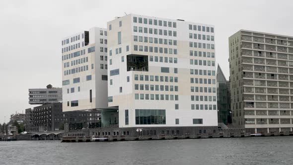 A moving shot of the IJ Dock where the justitial buildings in Amsterdam are situated at the famous w