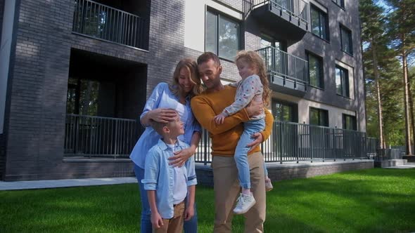 Family Walking at Summer Day at Backyard of House alt