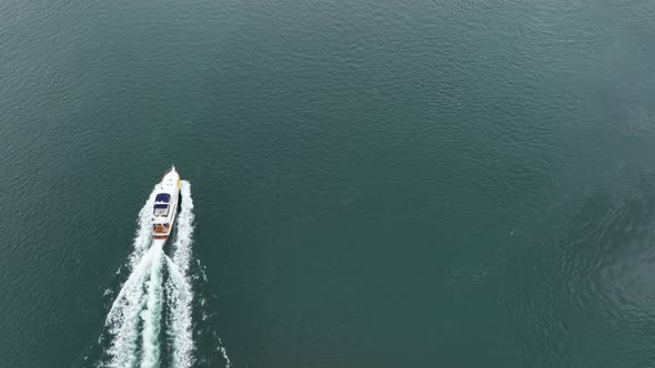 Overhead view of a large yacht cruising through the Pacific ocean.