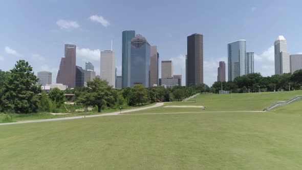 This video is about a low angle aerial view of downtown Houston from nearby park. This video was fil
