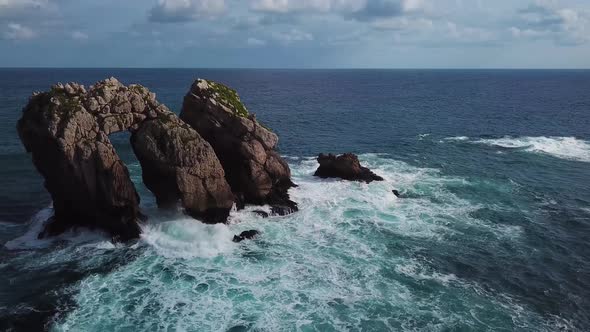 Aerial View of Reefs and Cliffs After Dawn on Arnia Beach. Northern Spain in Summer