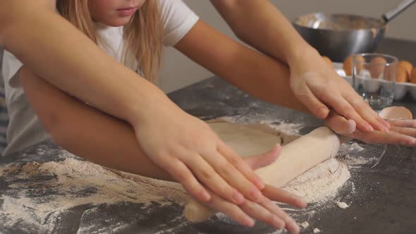 Happy Family in Kitchen. Mother and Child Daughter Preparing the Dough