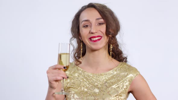 Portrait of Joyous Woman with Glass of Champagne