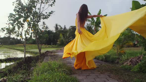 Gorgeous Woman Posing with Her Long Dress Outdoor