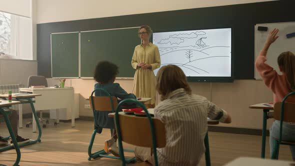 Teacher Explaining Lesson to Children