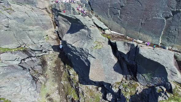 Flying over Trolltunga rock in Norway, aerial footage