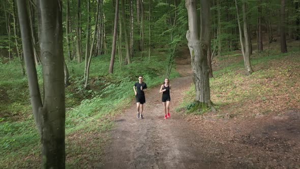 Sporty Couple Jogging on Nature