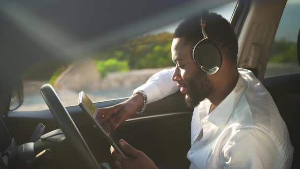 Side View Portrait of Carefree Smiling Joyful African American Gay Man Listening to Music in