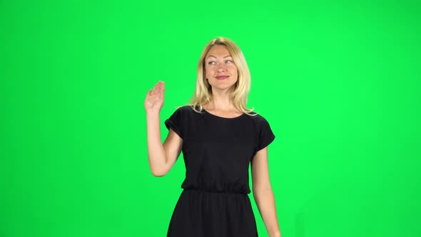 Contented Girl Is Walking and Waving a Hand Welcoming. Chroma Key