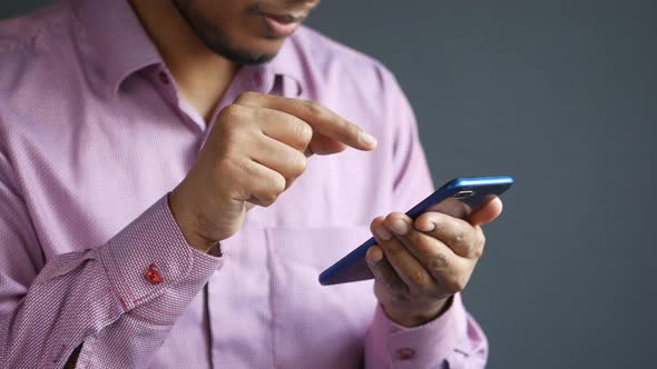 Close Up of Young Man Hand Using Smart Phone