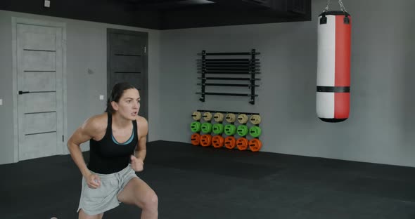 Woman Kickboxer Does Training Squats and Highkicks in Slow Motion Female Athlete Does Physical