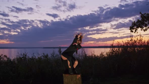 Happy Young Woman in Halloween Costume and Makeup Dances in Nature During Sunset Mystical Footage