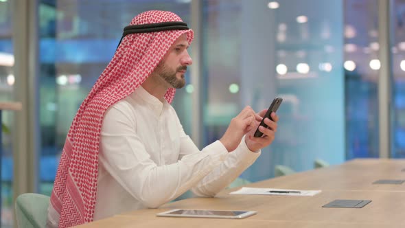 Text Messaging, Arab Businessman Using Smartphone