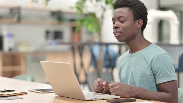 Video Chat By Young African Man on Laptop