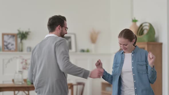 Attractive Couple Dancing and Enjoying at Home
