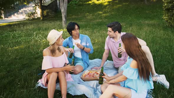 Young Multiracial Friends Having Picnic in Park