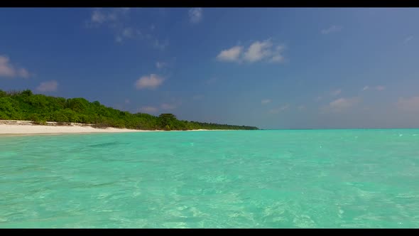 Aerial drone travel of paradise tourist beach lifestyle by turquoise lagoon and white sand backgroun