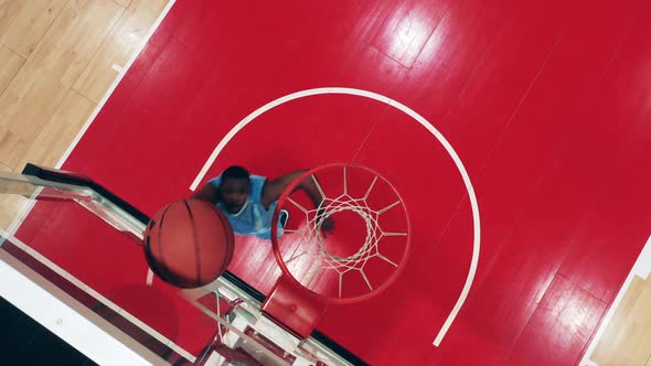 Top View of an Africanamerican Player Scoring in Basketball
