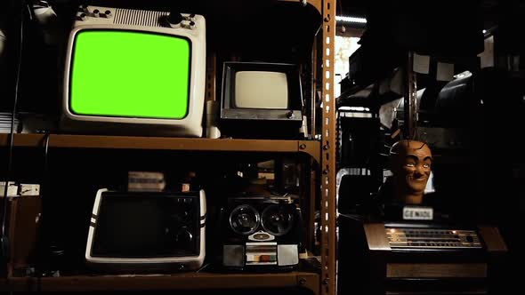 Old TV with Green Screen in an Antique Shop. Zoom In.