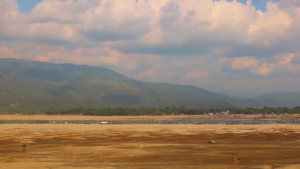 Majestic mountain region with sandy dessert in foreground, timelapse