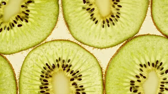 Macro Shot of Sliced Kiwi Fruit Slices and Rotate