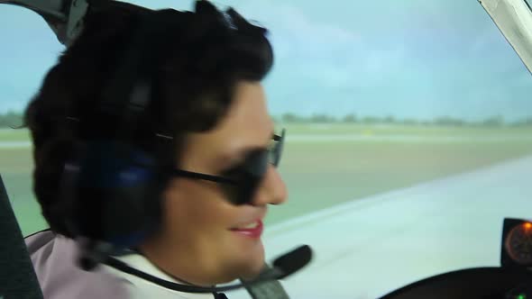 Happy Smiling Pilot Showing Thumbs Up Sign While Sitting in Cockpit, Profession