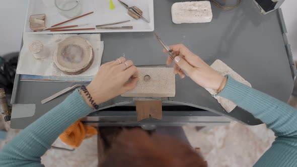 Top View Of A Small Business Female Jeweler Working In Studio