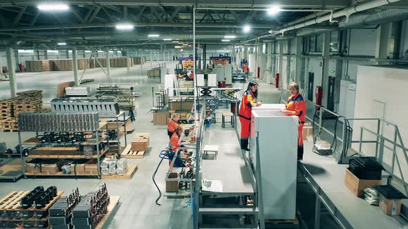 Refrigeration Factory with Female Workers Making Fridges