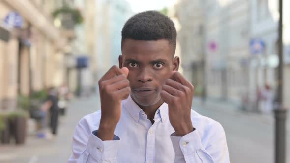 Portrait of Attractive African Man Fighting in Anger