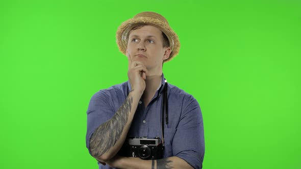 Portrait of Young Man Tourist Photographer Thinking. Chroma Key