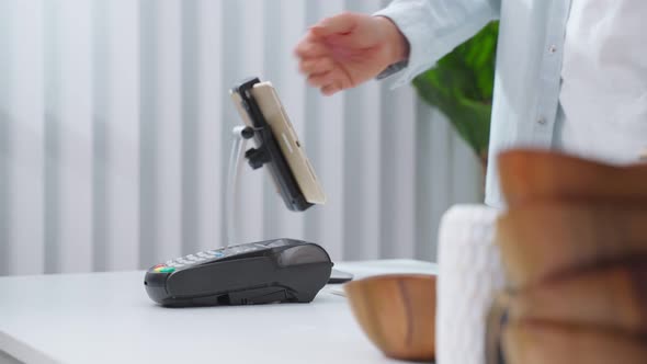 Close up hands of young man use credit card pay for vase goods order.