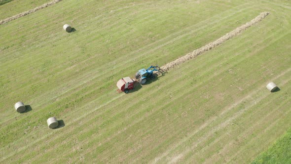 Blue Tractor Hay Bales Aerial View