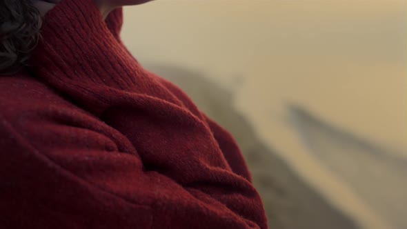 Peaceful Woman Enjoying Sunrise on Beach